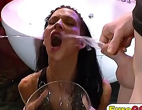 Skinny brunette hooker drinking cum and piss on gangbang sex act
