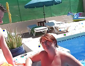 Posh Busty Cougar Jojo Seduces a Ray at the Pool